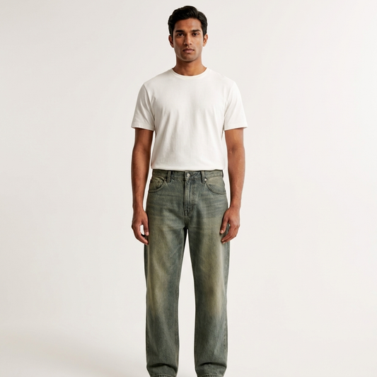 Front view of men's olive grey relaxed fit jeans on a model