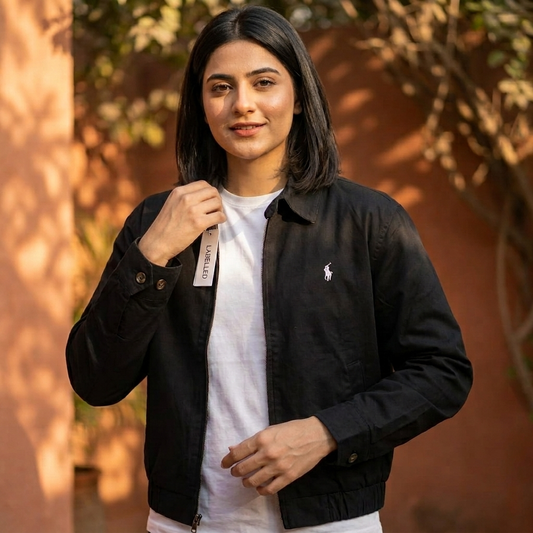 Woman wearing a black Ralph Lauren women's jacket in an editorial setting