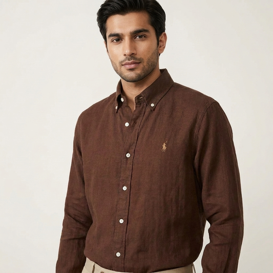 Model wearing a brown Ralph Lauren 100% linen washed shirt with dark trousers