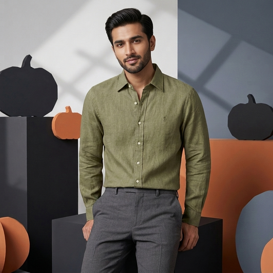 Model wearing an olive Ralph Lauren 100% linen washed shirt with tailored trousers