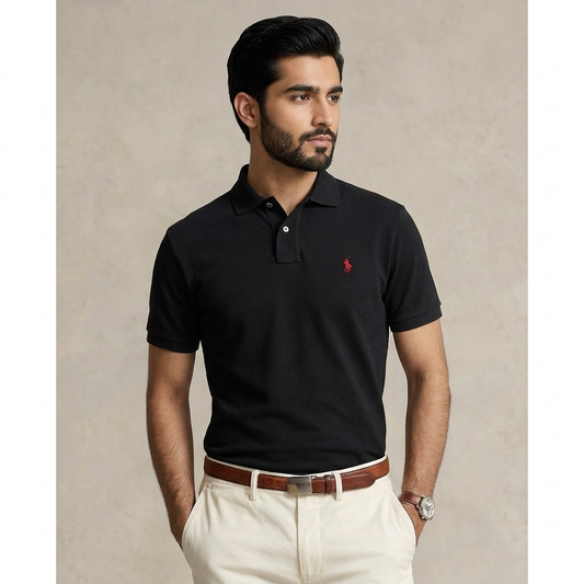 Model wearing a black Ralph Lauren polo shirt with dark trousers