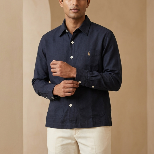 Man styling a navy Ralph Lauren shacket with light trousers