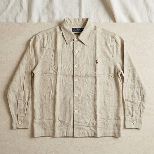 Beige button-up overshirt with three patch pockets, long sleeves and embroidered chest motif