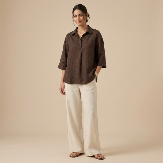 Model wearing a dark brown relaxed collared short-sleeve shirt