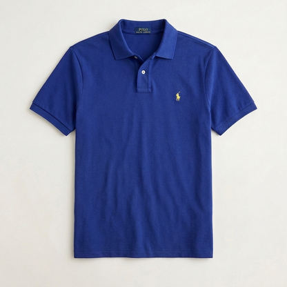 Model wearing a Fall Royal Ralph Lauren polo shirt with neutral trousers