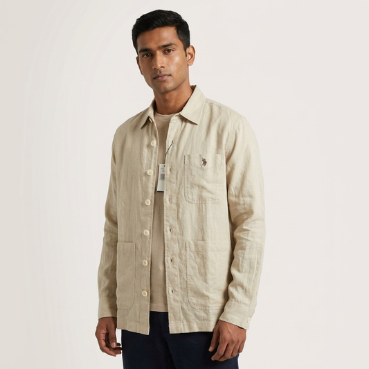 Man styling a beige Ralph Lauren shacket over a white T-shirt