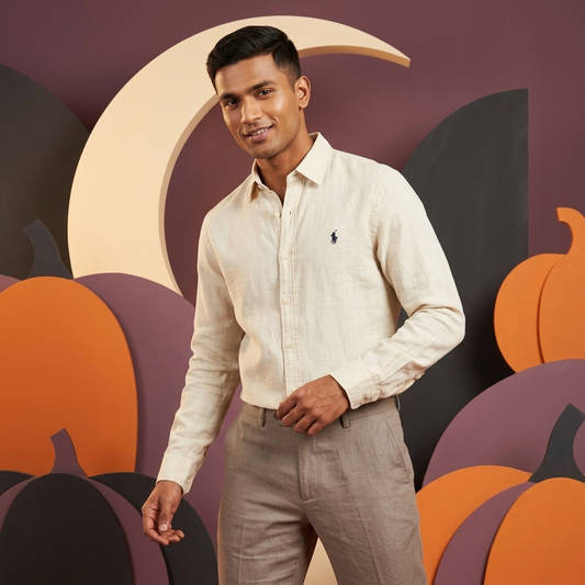 Model wearing an off-white Ralph Lauren 100% linen washed shirt indoors